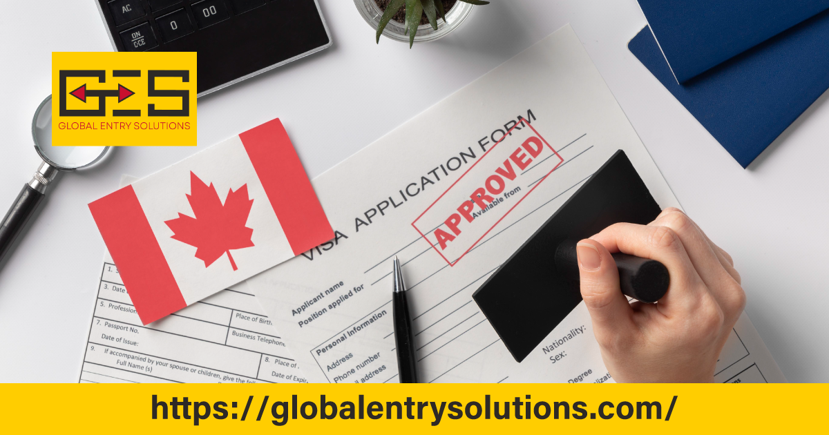 A professional working at a desk with a Canadian flag and visa documents