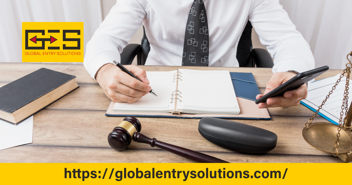 Lawyer working at a desk with legal tools and documents symbolizing the importance of legal representation in the H-1B visa application process